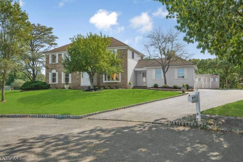 Welcome to 5 Cray Court, a beautifully updated Northwest facing home tucked away on a peaceful cul de sac in Hillsborough's sought after Willow's Edge community.