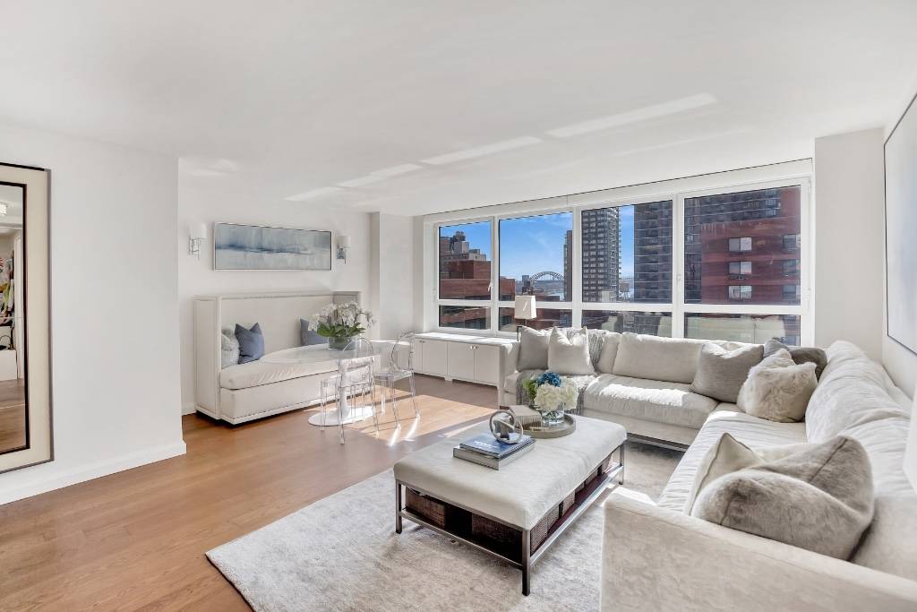 SUN DRENCHED designer three bedroom, two bathroom luxury condominium featuring incredible renovations and private park views in a perfect Carnegie Hill location.