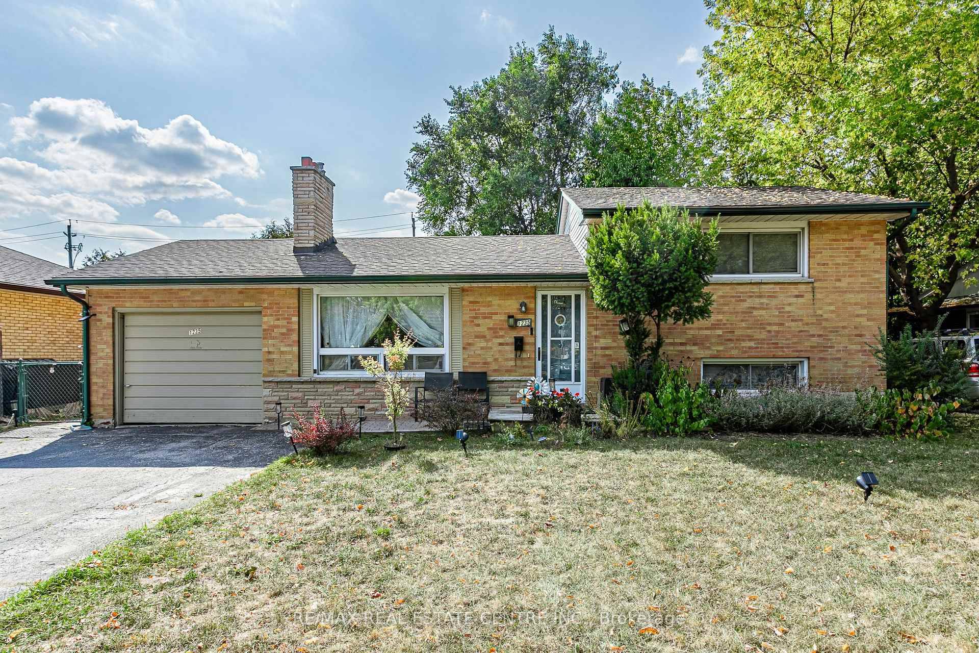 Bright and spacious 2 1 bedroom side split featuring an open concept layout with an updated kitchen, two full bathrooms, and abundant natural light that creates a warm and welcoming ...