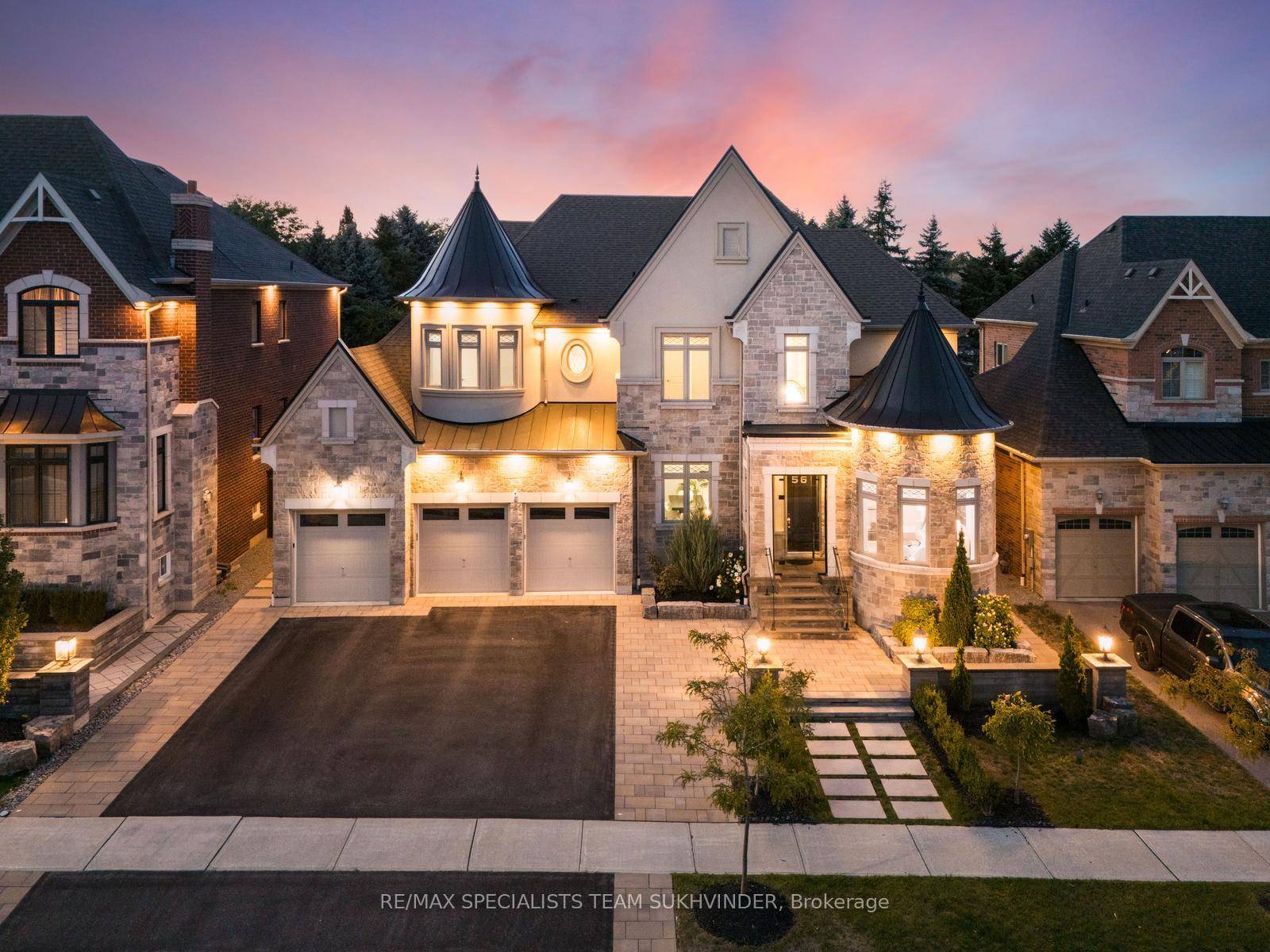 Architecturally captivating estate in sought after Sharon, set on a premium 69 x142 ft lot.