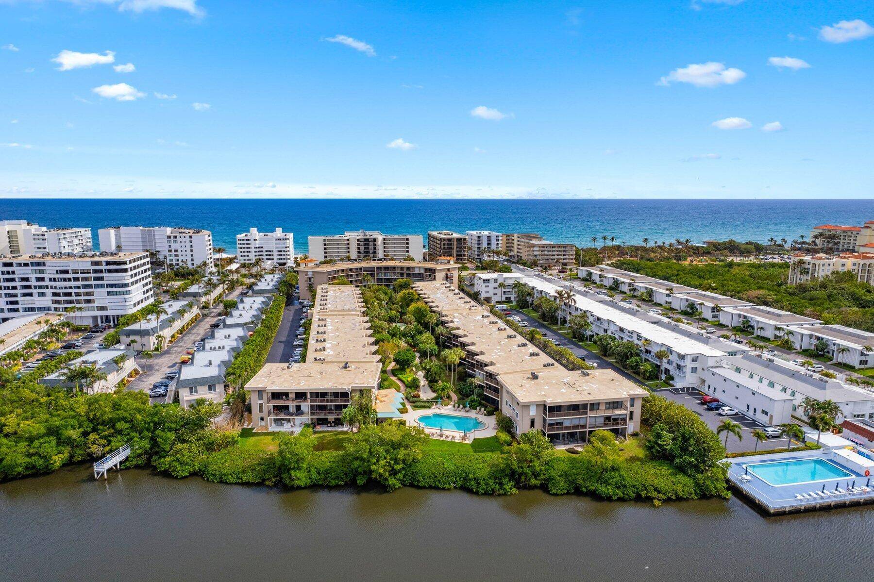 This stunning 2 bed 2 bath condo located on the intracoastal on the 1st floor has tropical garden views and a screened in patio.