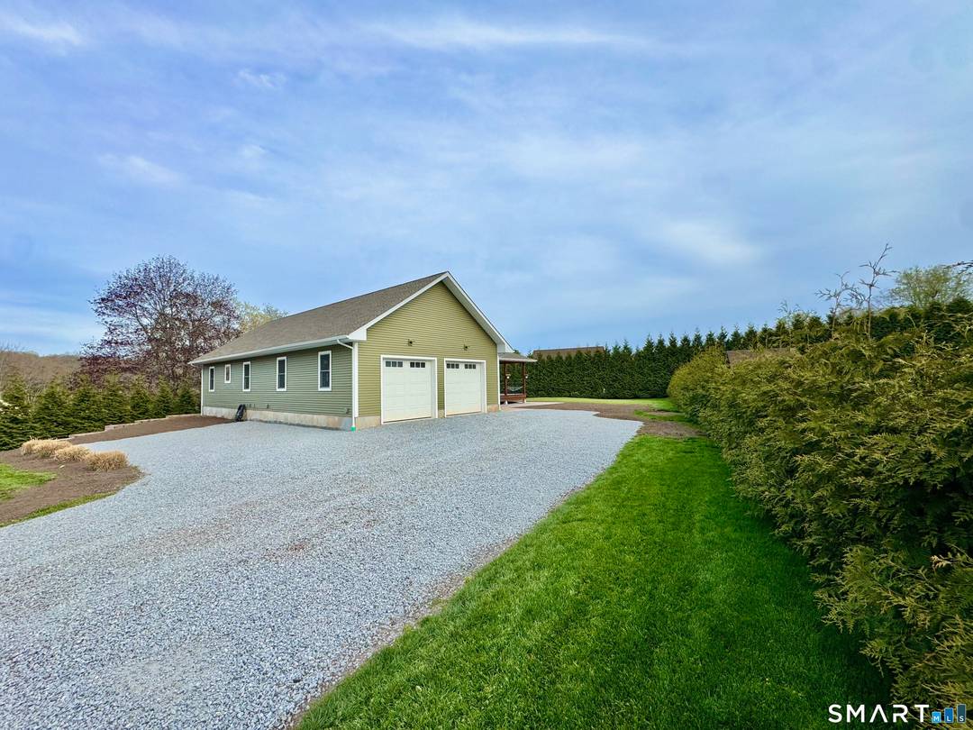 Built in 2021, this beautifully finished ranch sits on a quiet road in the heart of Moodus.