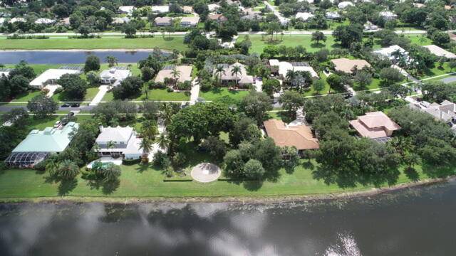 Stunning Lakefront Property with Key West Style Home and Adjacent Lot.