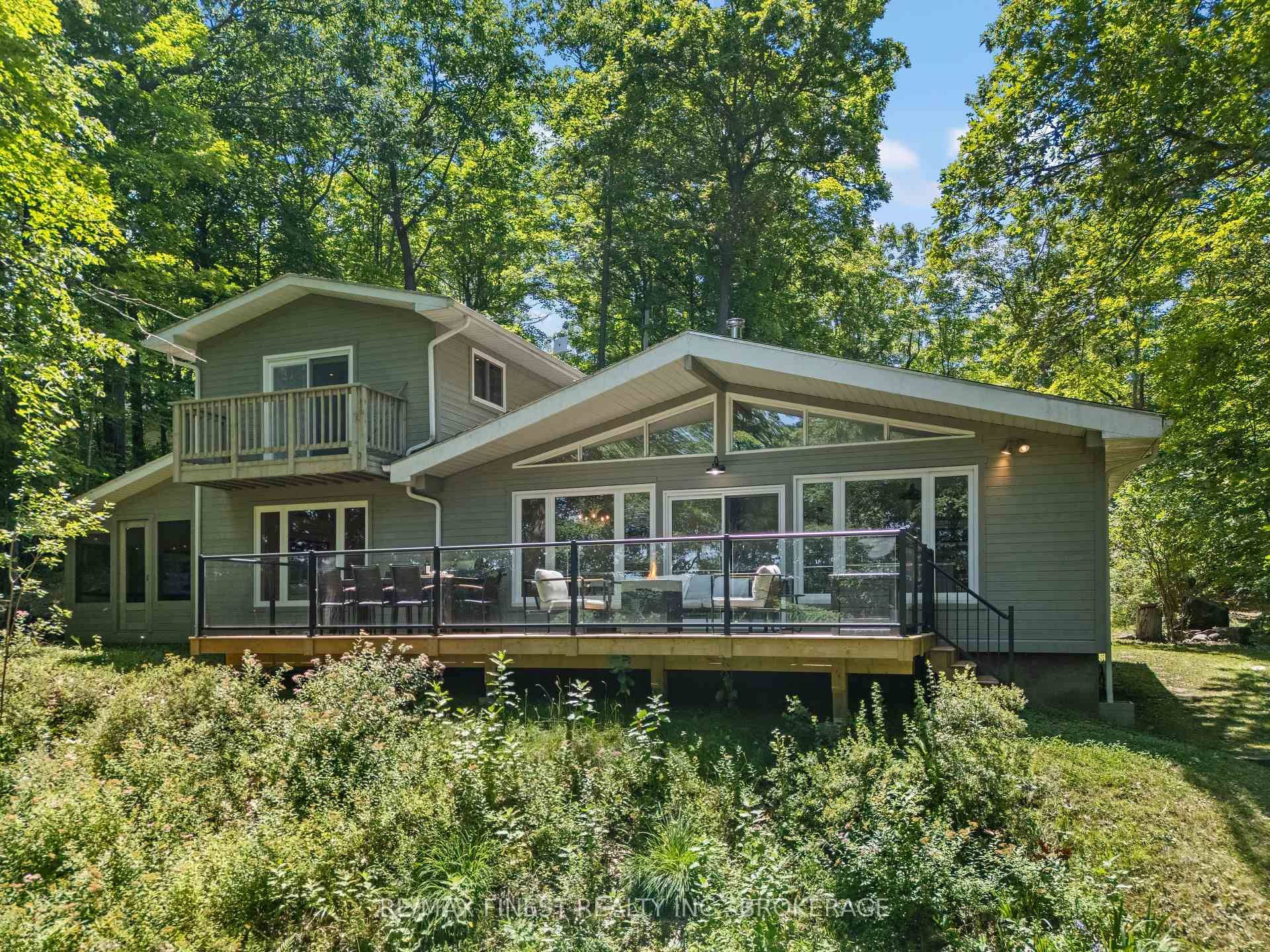 This 1890 sq ft custom built, year round 5 bedroom, 2 bath home on the pristine shores of Thirteen Islands Lake.