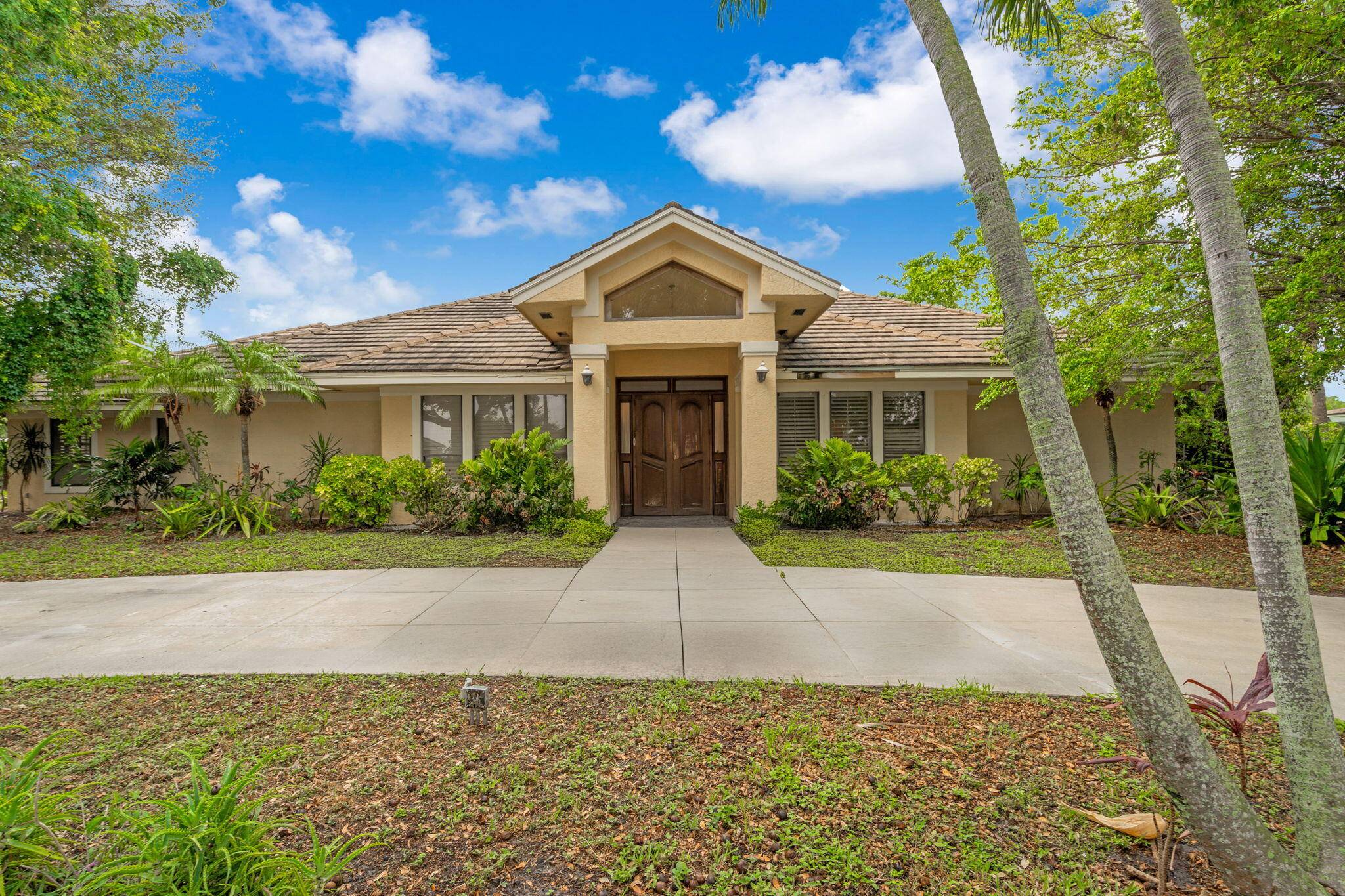 Experience the best of South Florida living in this spacious home nestled within a secure, gated community just minutes from the excitement of West Palm Beach, the elegance of Palm ...