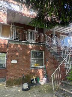 COME VIEW THIS LARGE BRICK 2 FAMILY HOME IN CANARSIE.