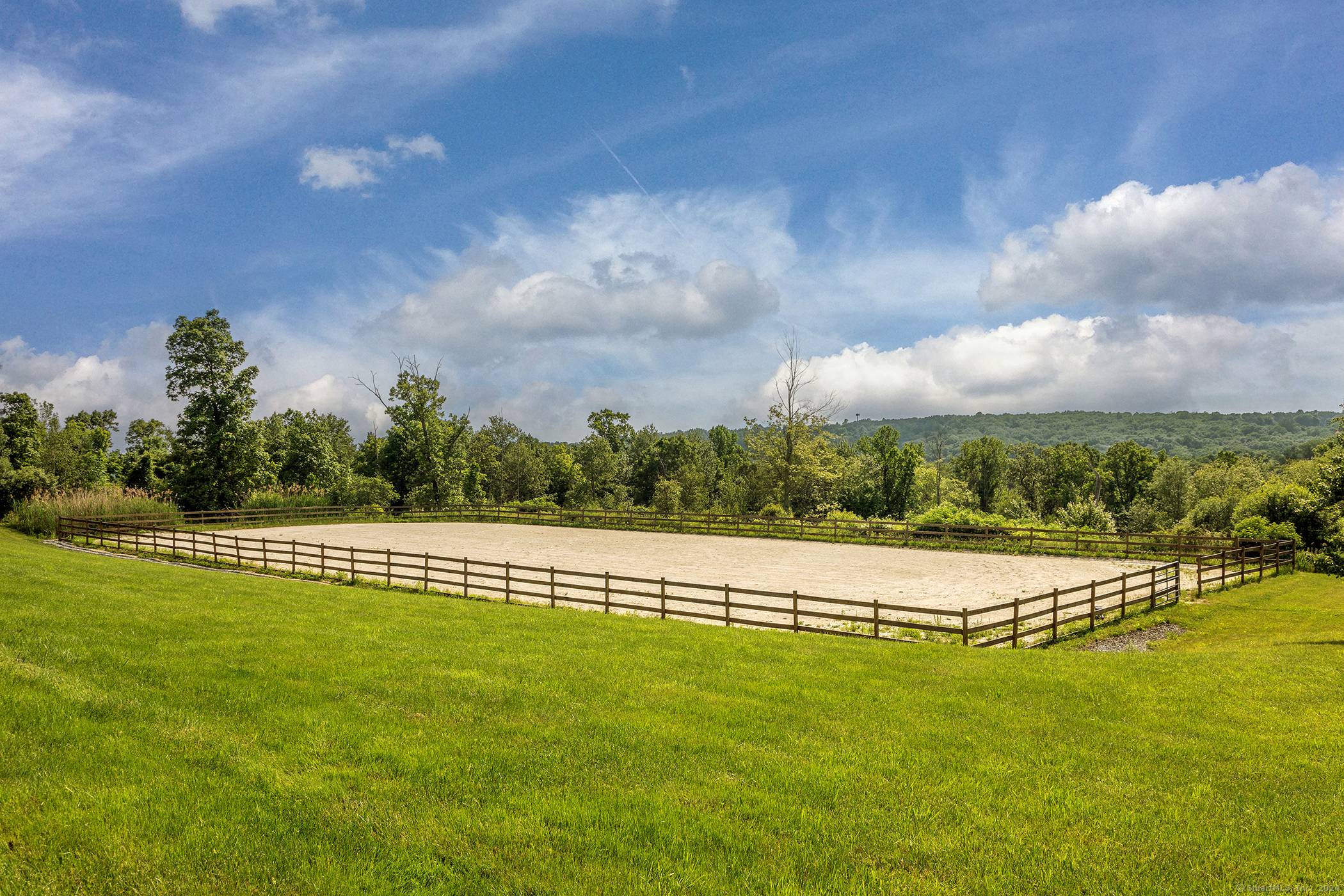 Shingle style home with horse barn, paddocks riding arena, set on over 9 acres with a gorgeous westerly view of Roxbury's bucolic rolling hills !