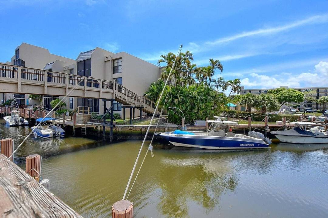 Wake up to sparkling canal and lagoon views from this beautifully renovated 2BR 2BA SE facing condo in Boca Bayou.