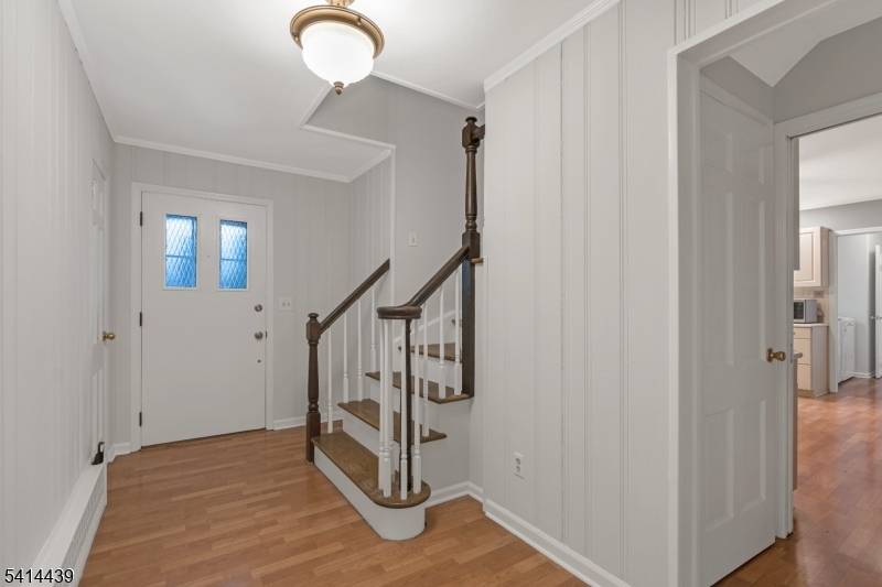 Recently updated expanded ranch with large rooms, abundant closet space, open yard, front porch, new laminate flooring, freshly painted throughout, 2 car garage, full unfinished basement, patio, wood burning fireplace ...