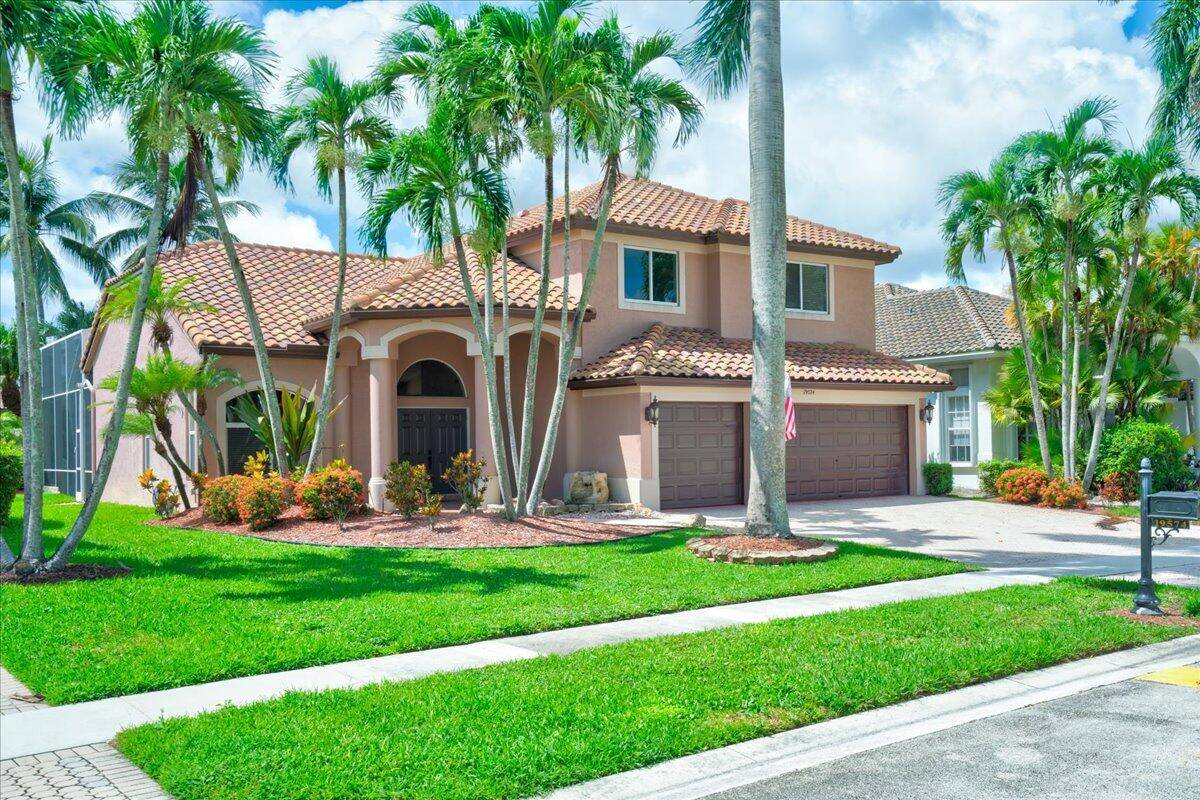 Most buyers see a pool. The sharp ones see a second living room outdoors a two story screened lanai framing wide lake views that feel like vacation every day.