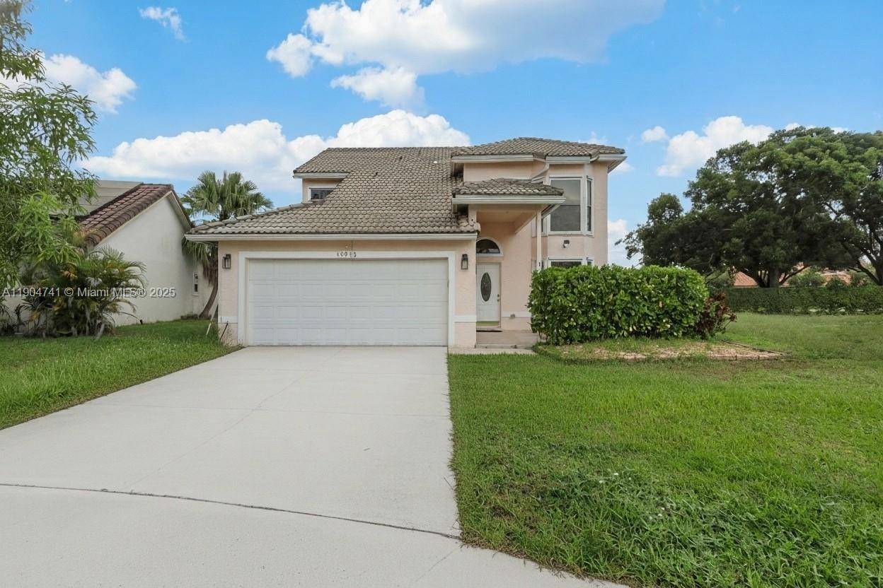 Beautifully updated 4 bedroom, 2 bath single family home in the desirable Amber Bay community of Lakes at Boca Raton.