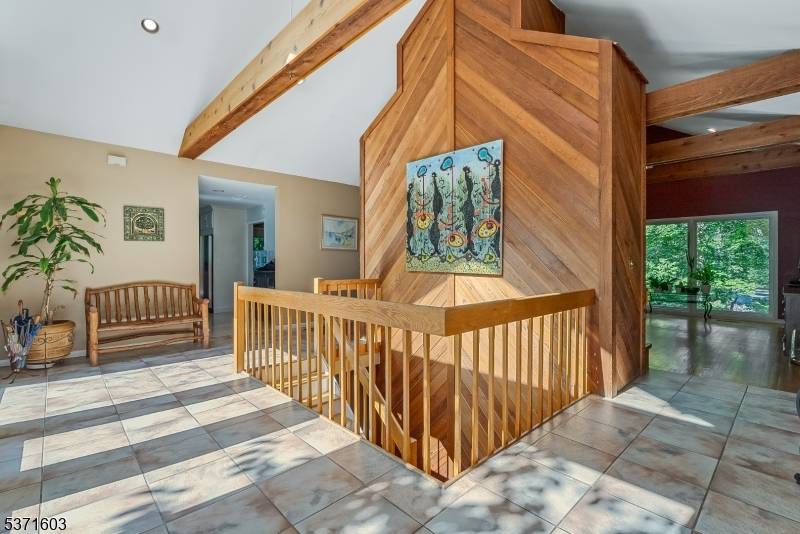 Serene ranch style retreat with separate in law suite, ideally situated on a quiet, private cul de sac in desirable Mendham Township.