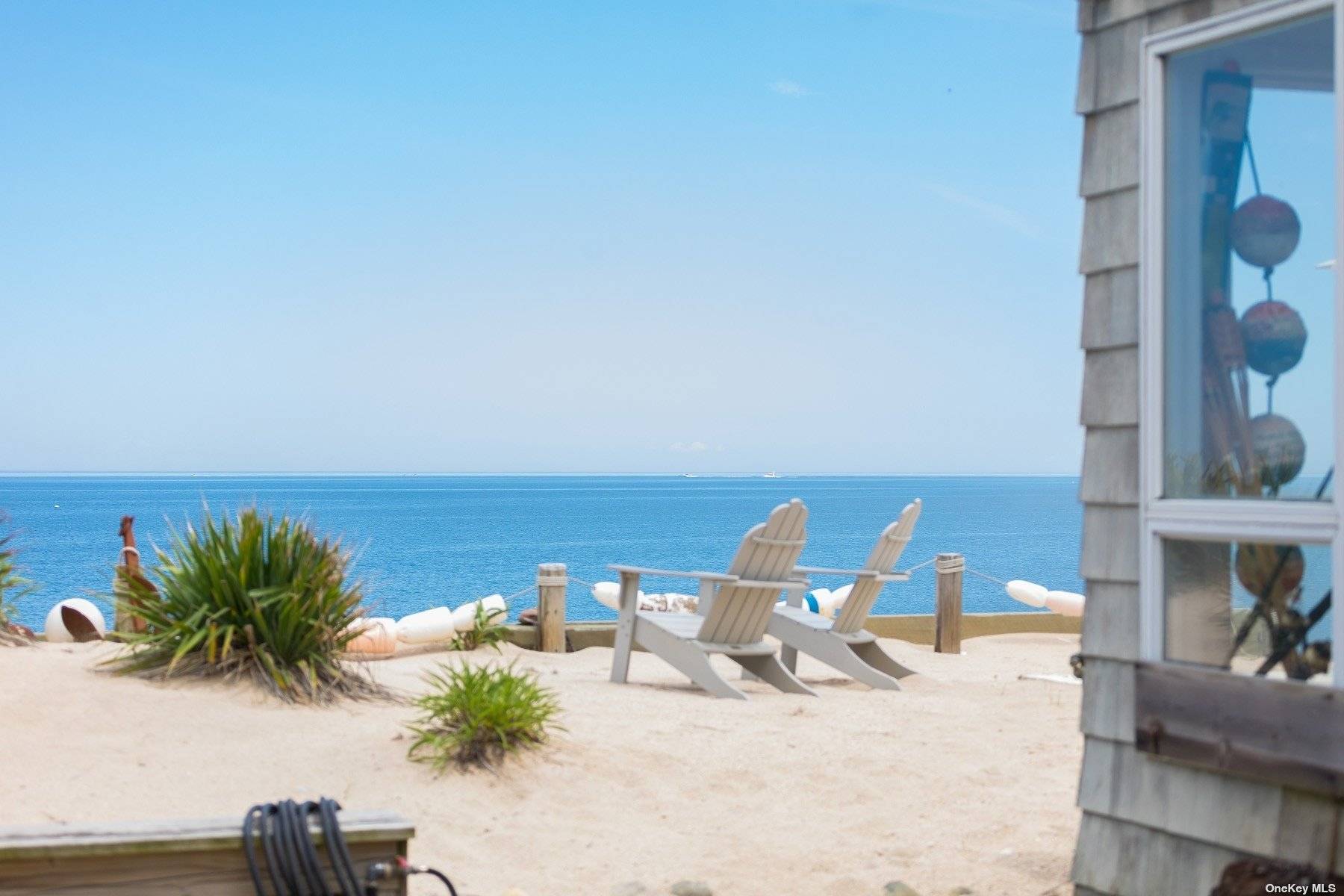 Live the Beach life ! ! Charming 4 BR Nantucket style home with sandy beach front in Asharoken.