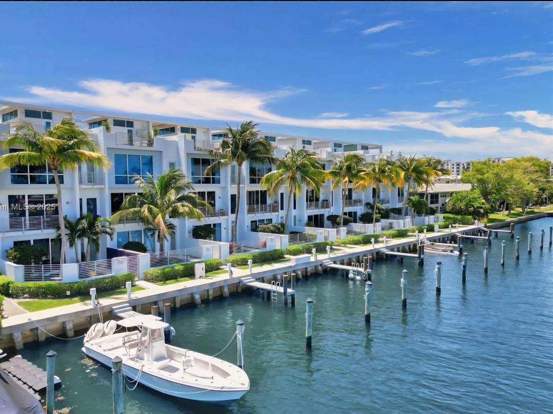 Experience waterfront living in this modern Intracoastal townhome with a private 30 ft boat slip, offered fully furnished for easy move in.
