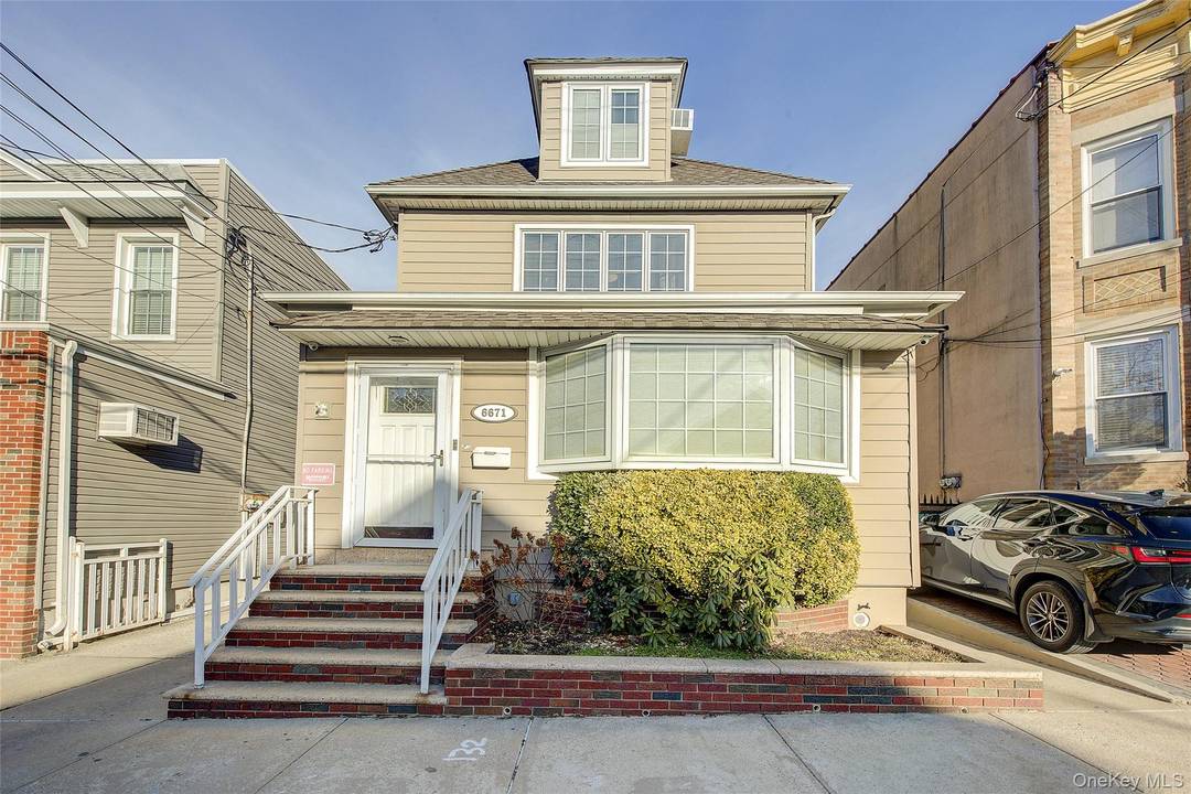 Welcome to 66 71 74th Street, a rare multi level mother daughter single family home in the desirable neighborhood of Middle Village.