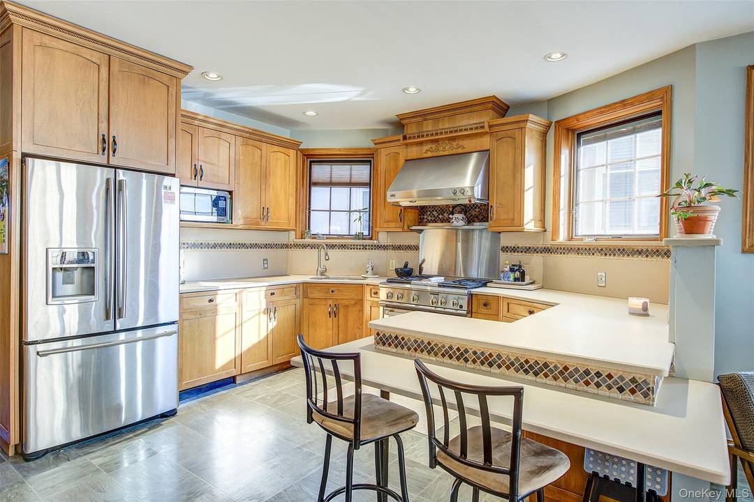 Welcome to 66 71 74th Street, a rare multi level mother daughter single family home in the desirable neighborhood of Middle Village.