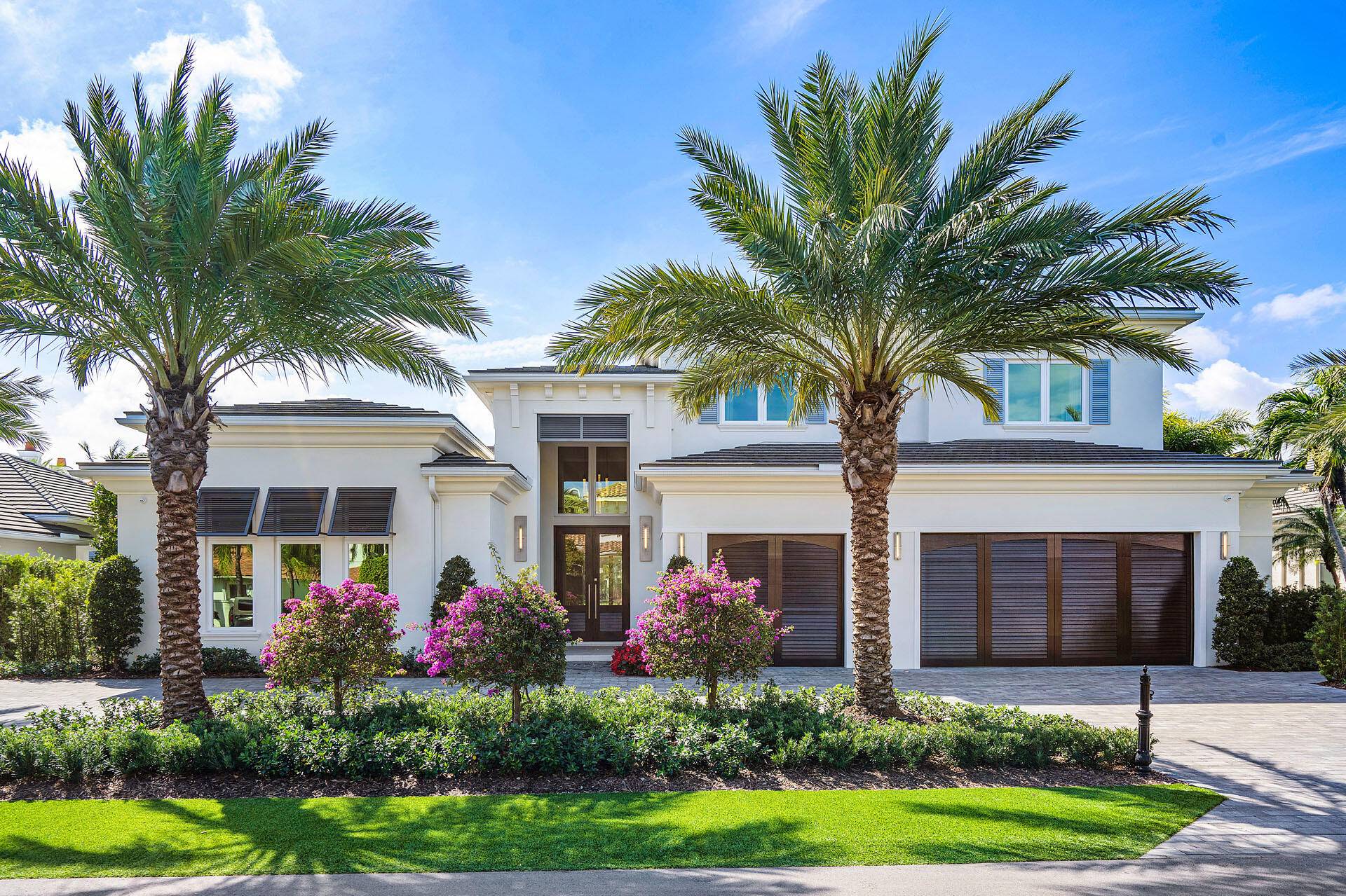 Built by Bloomfield Construction in 2019, 148 Thatch Palm Cove offers an exceptional blend of modern luxury and golf course tranquility.