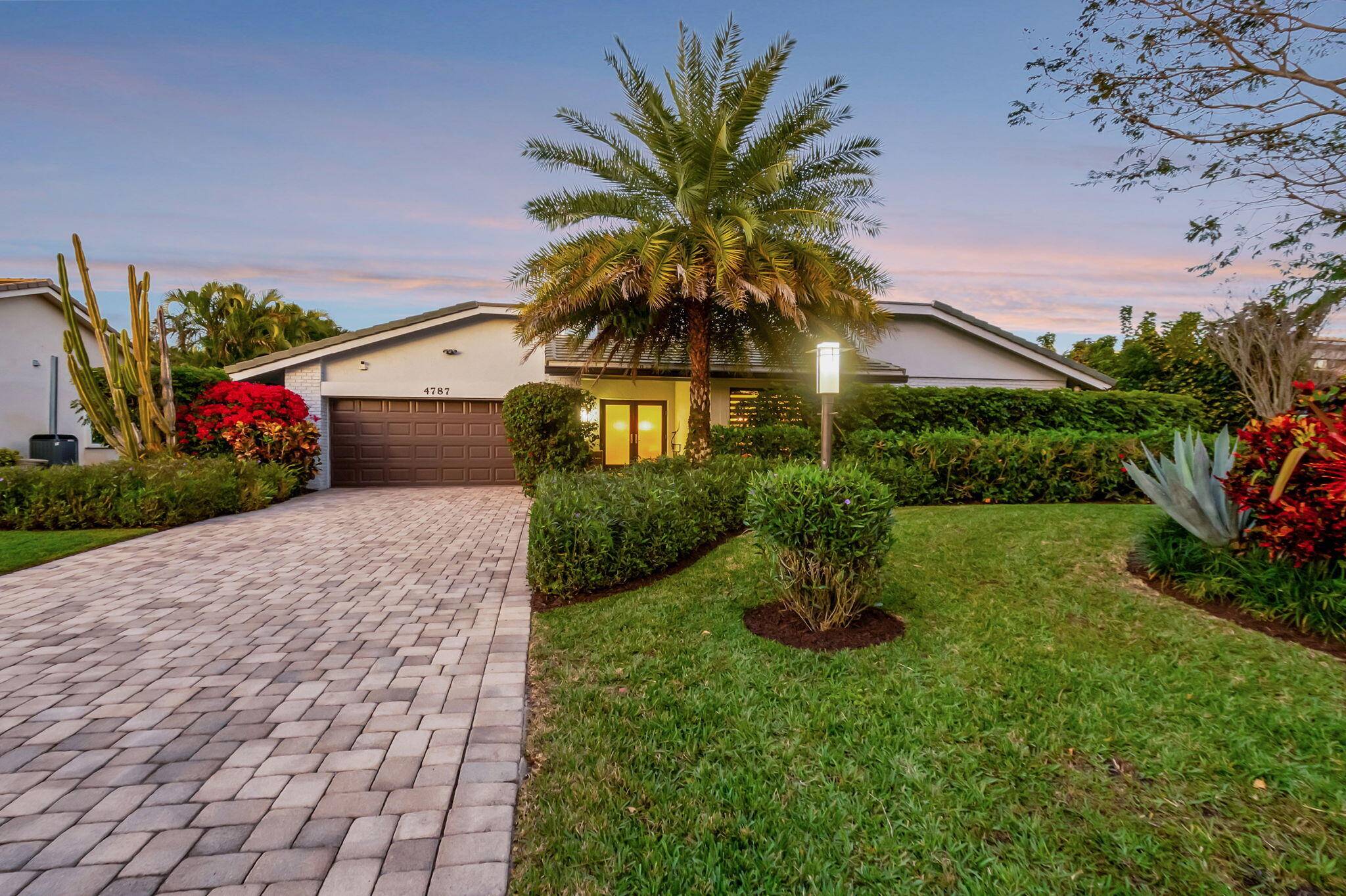 Discover this exceptional home in the highly sought after Seagate Golf at The Hamlet, Delray Beach's premier gated community, where membership is available but not mandatory.