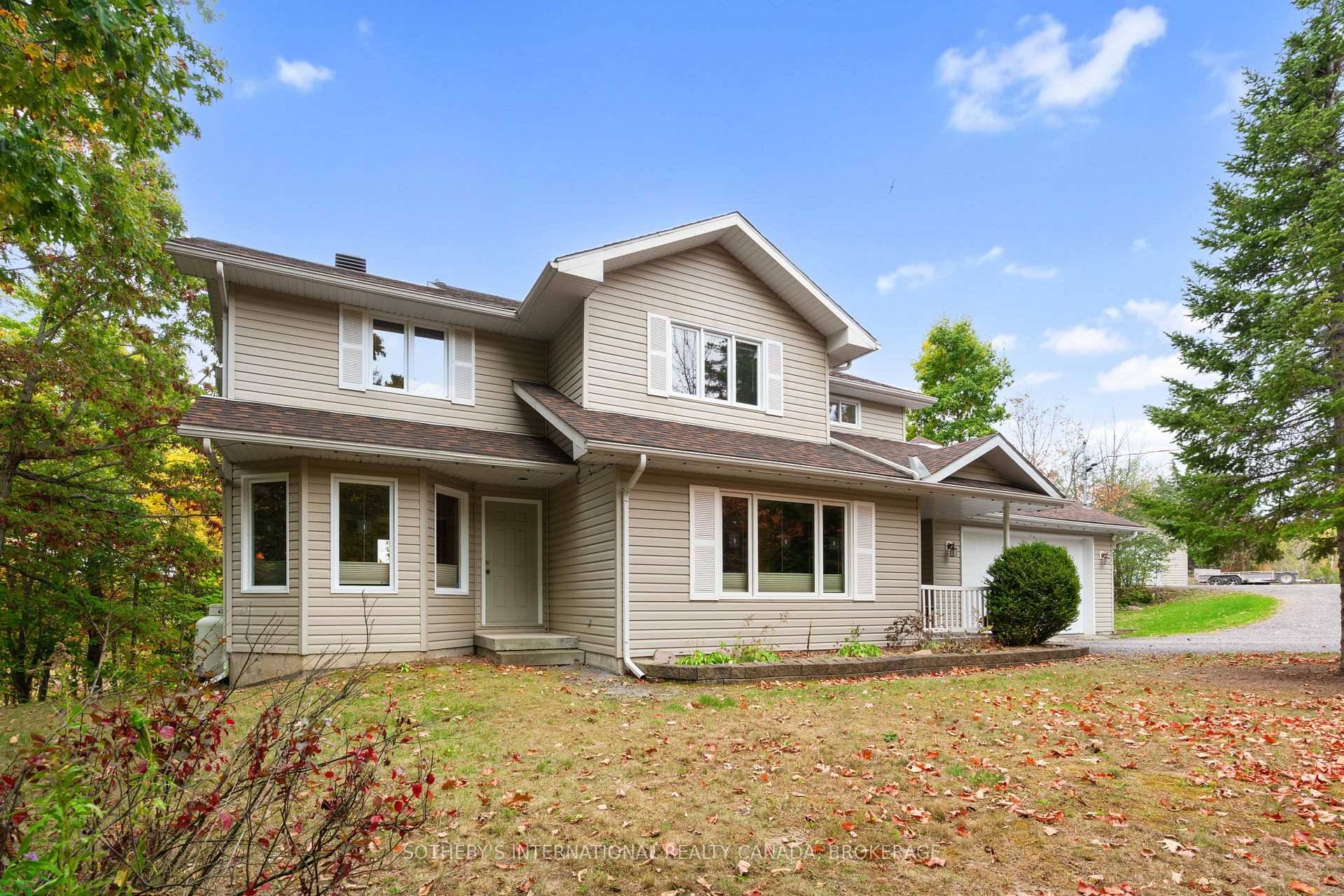 Tucked within a canopy of mature trees along a peaceful country road, just minutes from one of the region's most enchanting waterfront villages, this impeccably maintained residence offers the rare ...