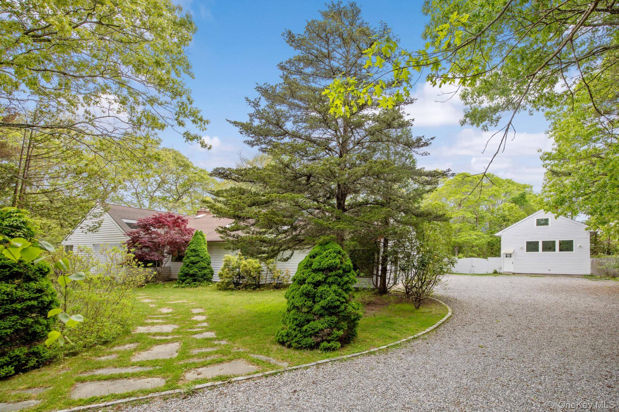 Located at the end of a quiet cul de sac, this 4 bedroom, 3 bath home offers one level living on a private, park like acre.