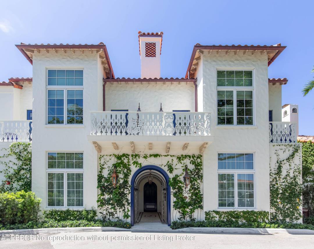 Discover timeless luxury in this rare landmarked jewel tucked within Palm Beach's exclusive Phipps Plaza.