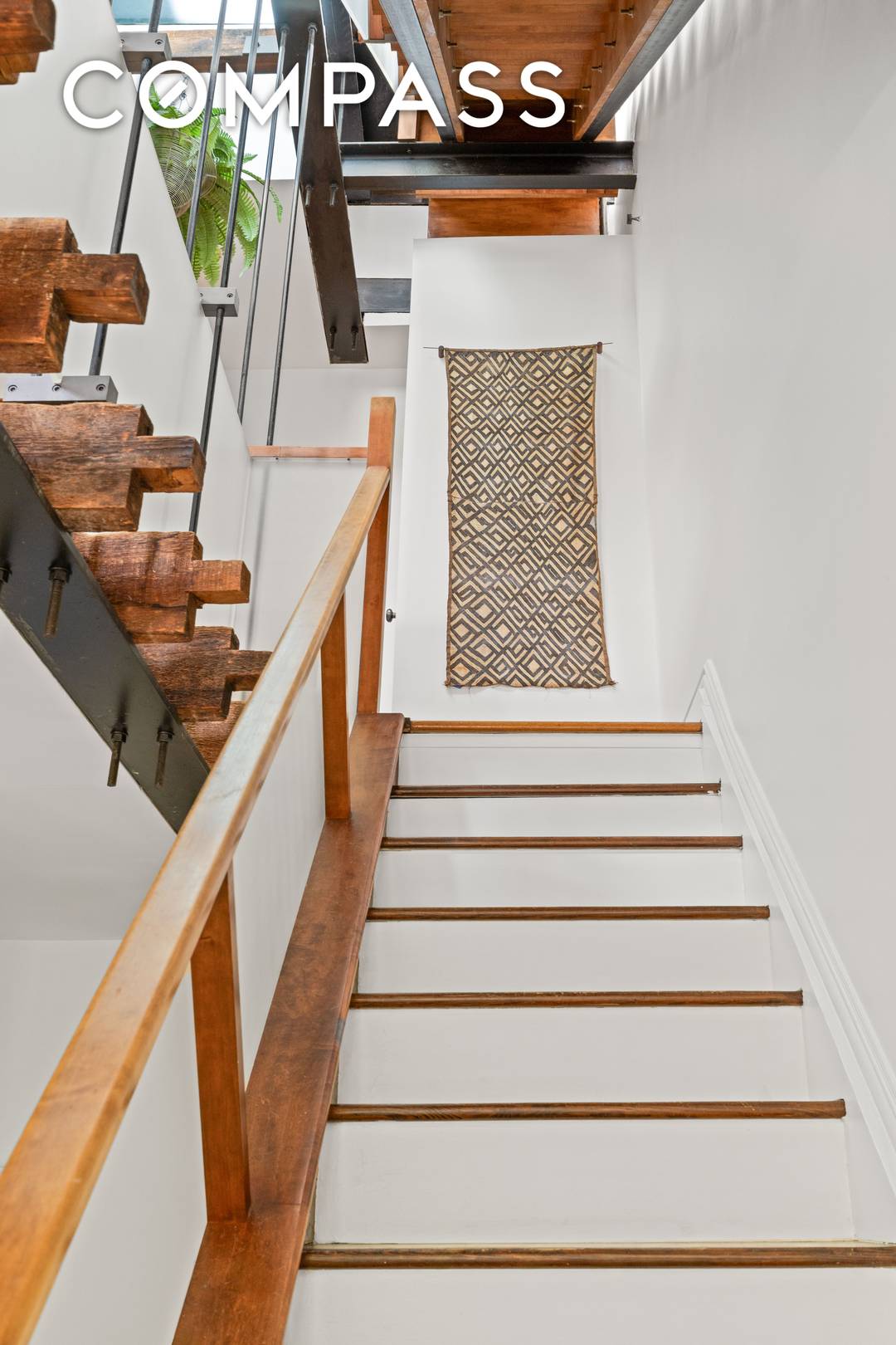 Ideally located on a picturesque, tree lined street in a stately five story brownstone, this rare 4 bedroom, 2 bath triplex is a masterful reimagining of two combined units.