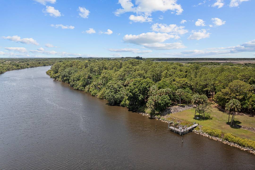 Tranquil 5 acre waterfront property in Palm City, conveniently located near schools, restaurants, shopping, and major highways.