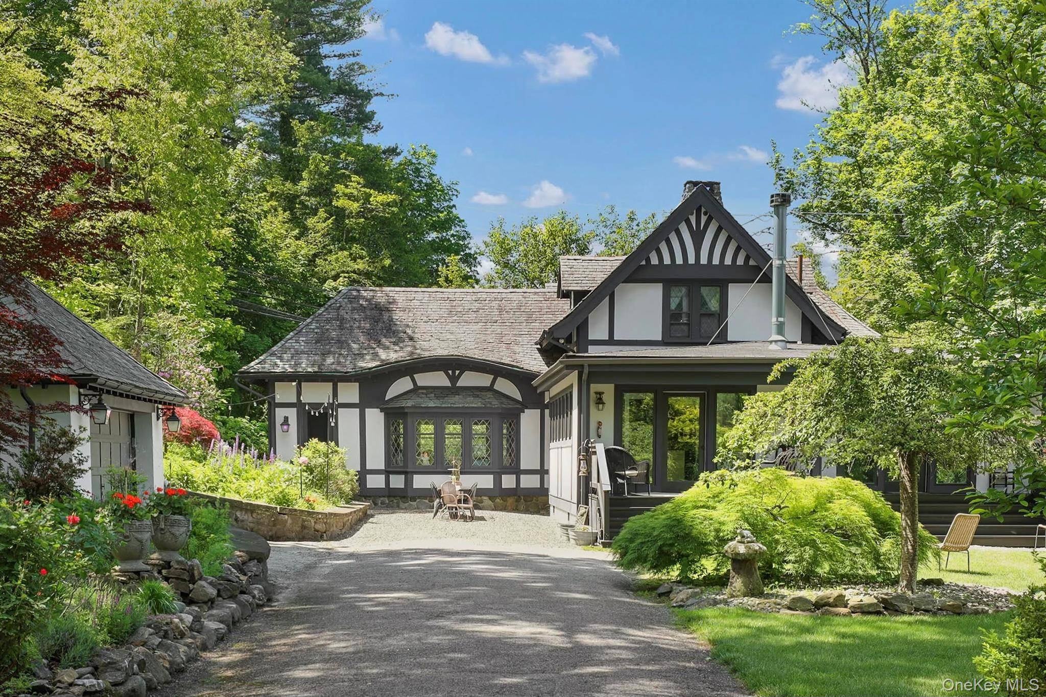 Behind stately iron gates on a quiet, tree lined street in the heart of Briarcliff Manor, a remarkable home awaits steeped in history, wrapped in charm, and gracefully updated for ...