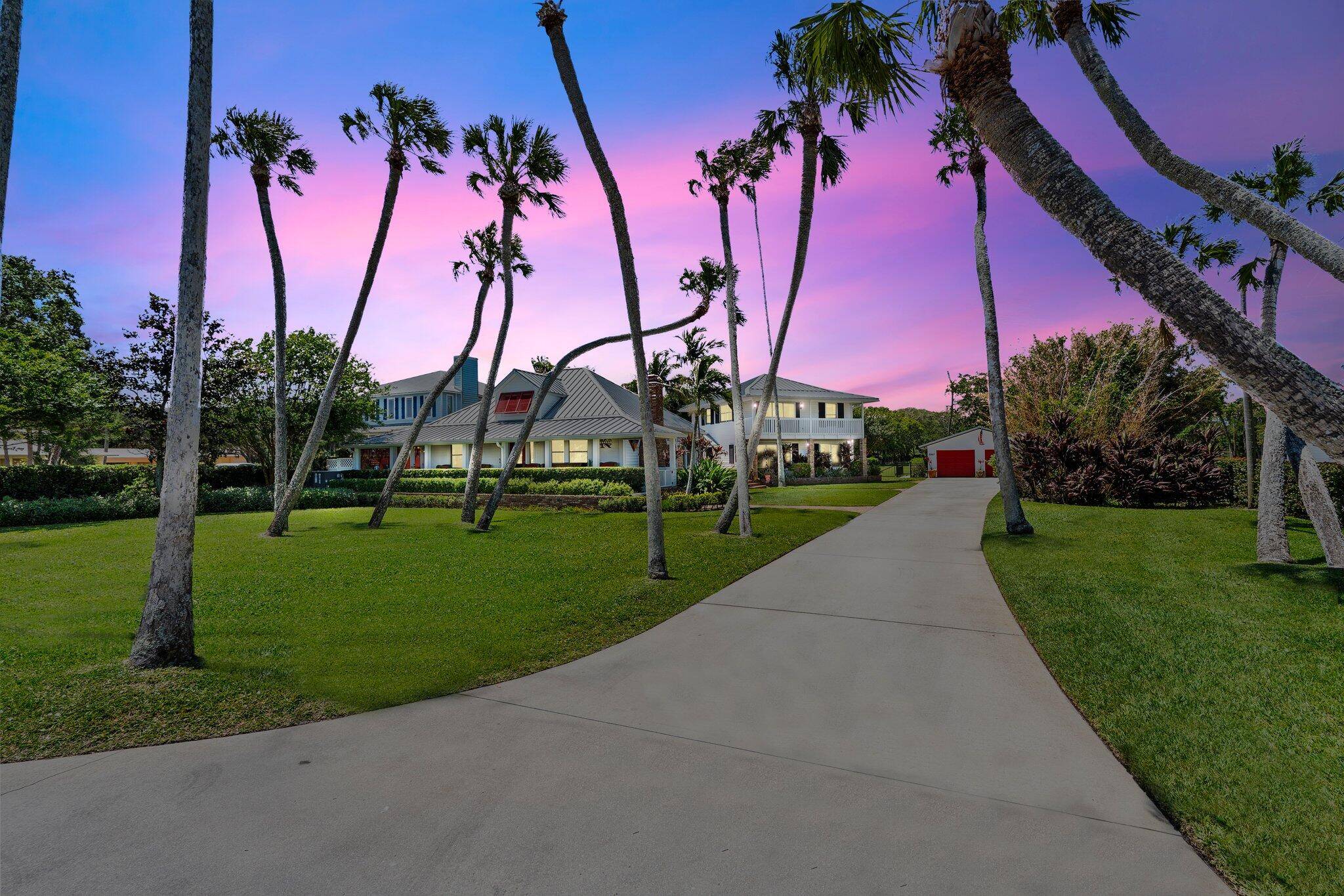 Experience the ultimate in coastal luxury with this rare open water estate set on approximately 3.