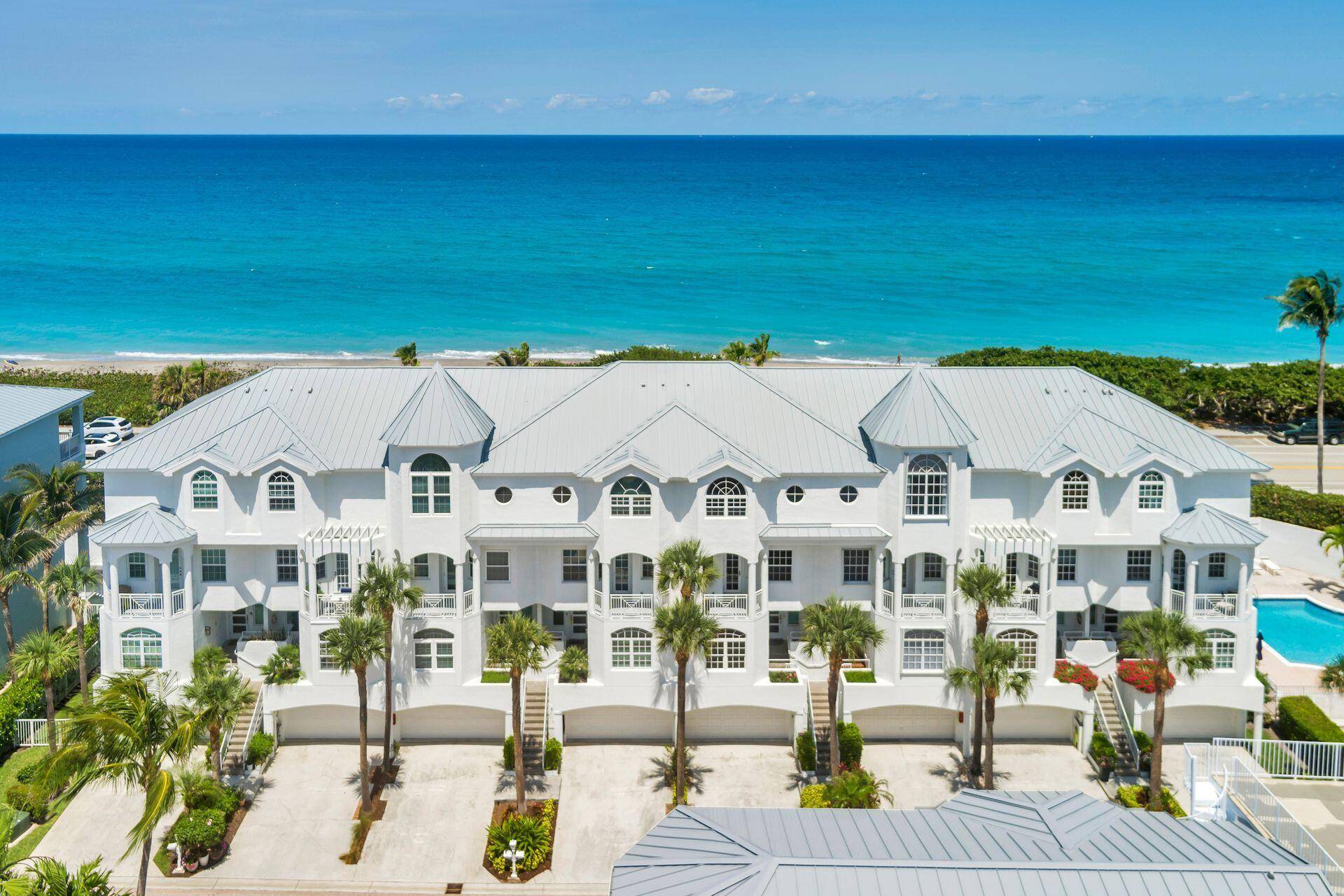 Enjoy panoramic beach and ocean views from this bright and spacious 4 bedroom, 4 bath townhouse in the exclusive, gated community of Jupiter Key.