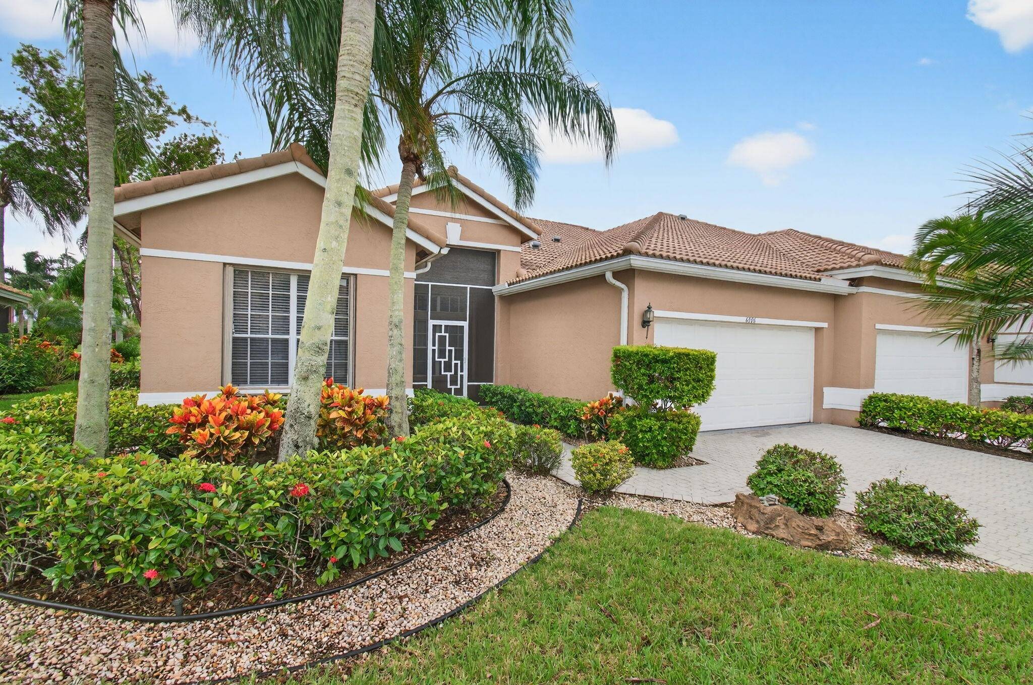 Embrace the tranquility as well as the full array of conveniences offered by this exceptionally maintained property, located at 6886 Swan Sea Lane, Boynton Beach, FL.