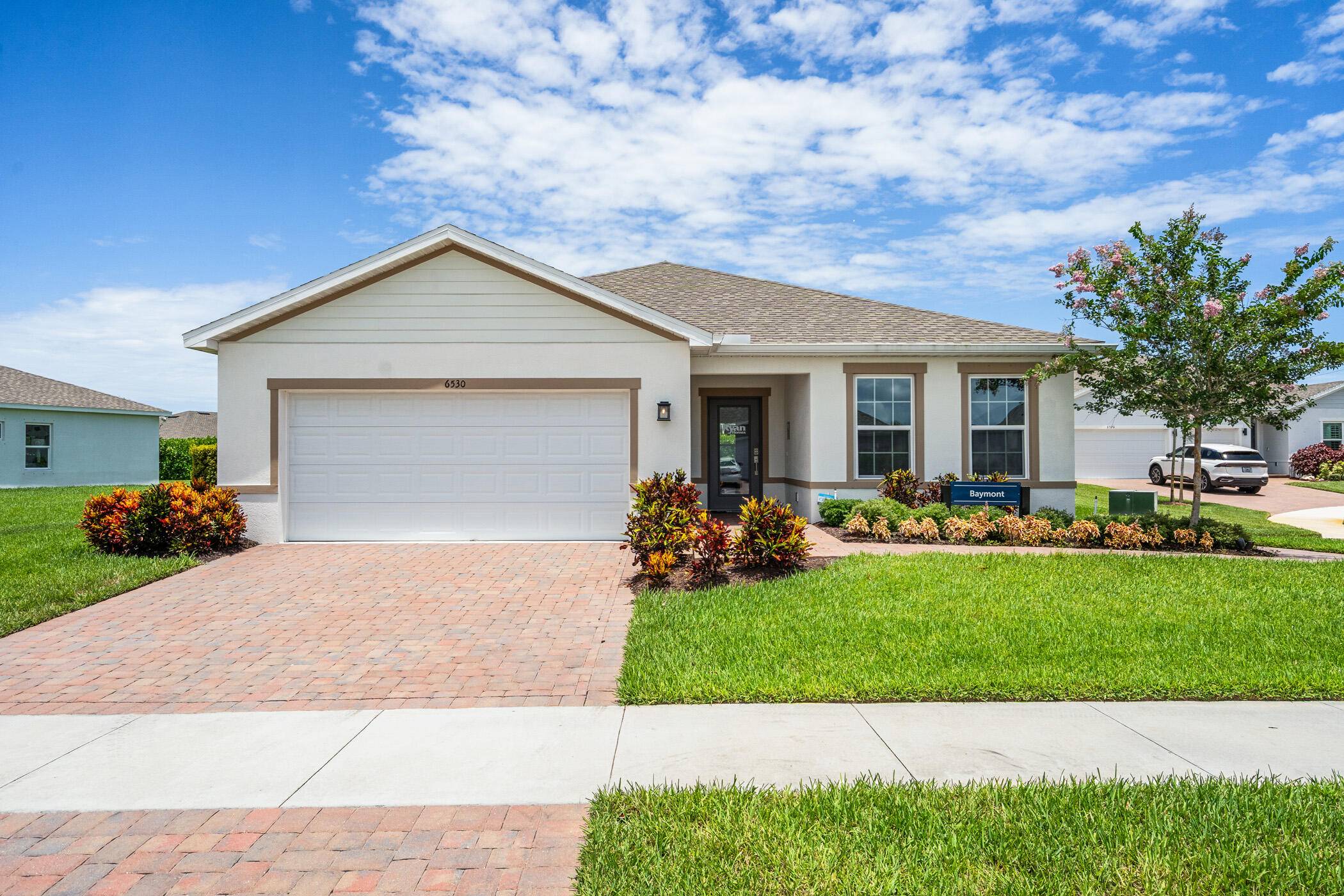 Experience the effortless elegance of the Baymont model a former showcase home by Ryan Homes never lived in perfectly positioned in the sought after Lost Tree community in beautiful Vero ...
