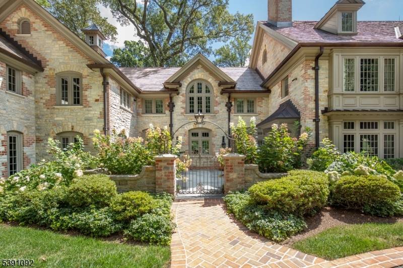 An architectural masterpiece on the Bernardsville Mountain is set on 5 manicured acres.