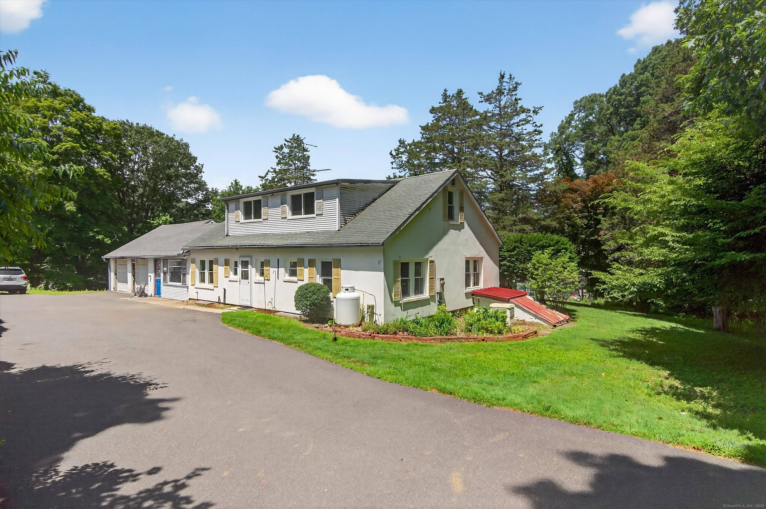 Step into this beautifully updated three bedroom with den, 2 full bath Cape Cod home.