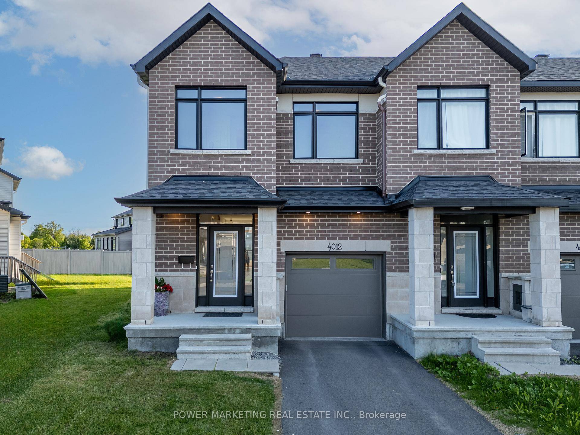 Welcome to your dream corner end unit townhome with a single driveway, nestled on a generous lot that offers both space and privacy.