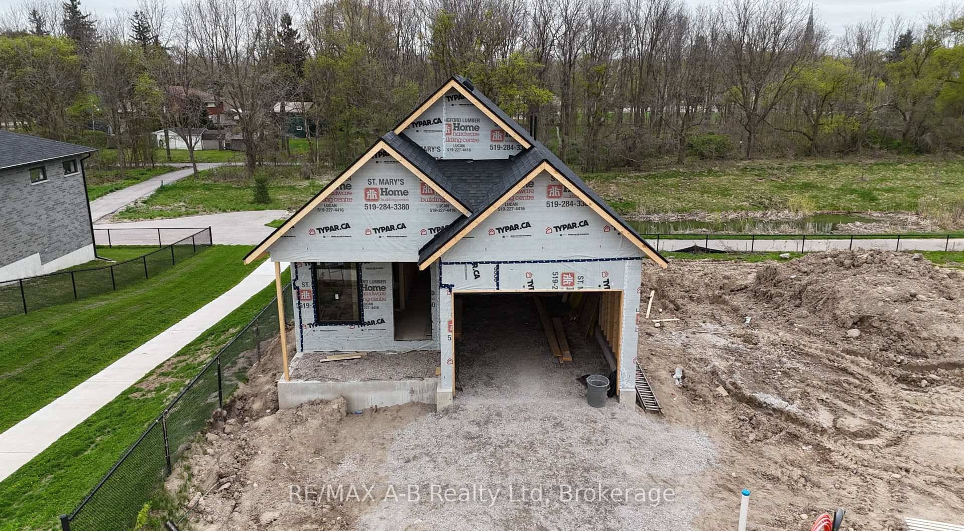 This beautifully designed bungalow with a fully finished walk out lower level backs directly onto greenspace and the nearby walking trail, offering a peaceful and private setting.
