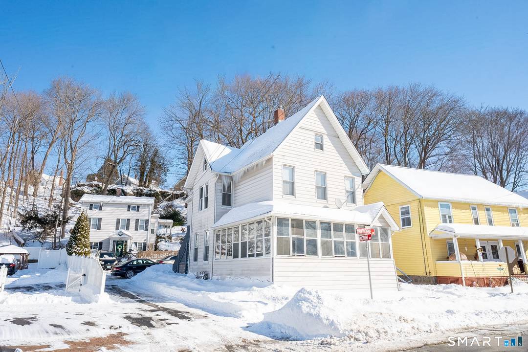 Spacious two family home with recently renovated interiors in both units.