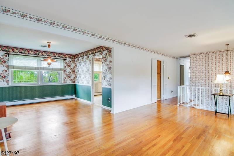 Welcome to this beautifully maintained and generously sized 4 bedroom bi level home, set on nearly half an acre of serene, park like grounds.