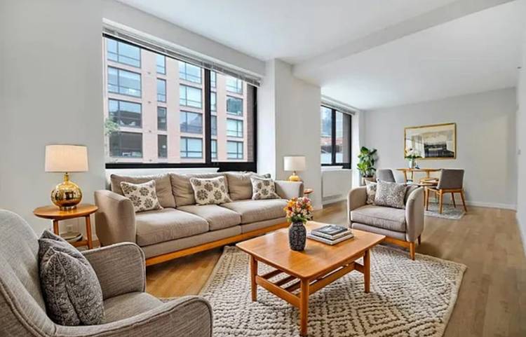 This massive three bedroom two and 1 2 bathroom home features an in unit washer dryer, oak plank flooring, double pane windows, stainless appliances and custom cabinetry.