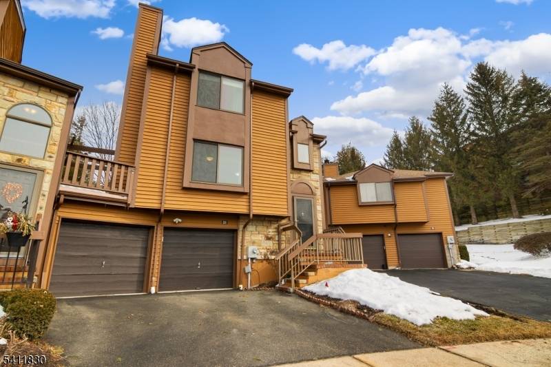 Lovely Brandon 2 model sitting right in the cul de sac this unit has a family room off the kitchen w wood burning fireplace, large kitchen w corian counters, built ...