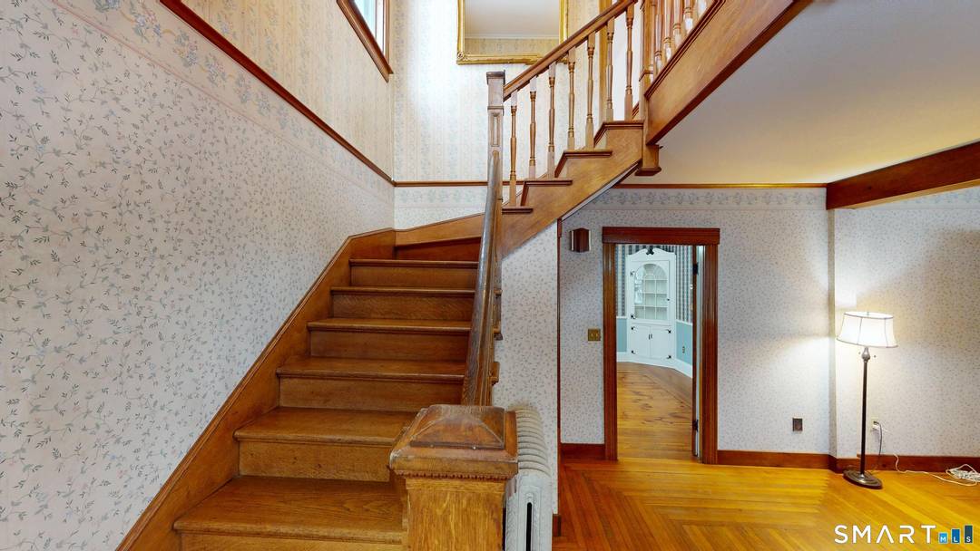 Step into timeless elegance in this remarkable 1922 Antique Colonial Victorian, gracefully set in the heart of Putnam, Connecticut.