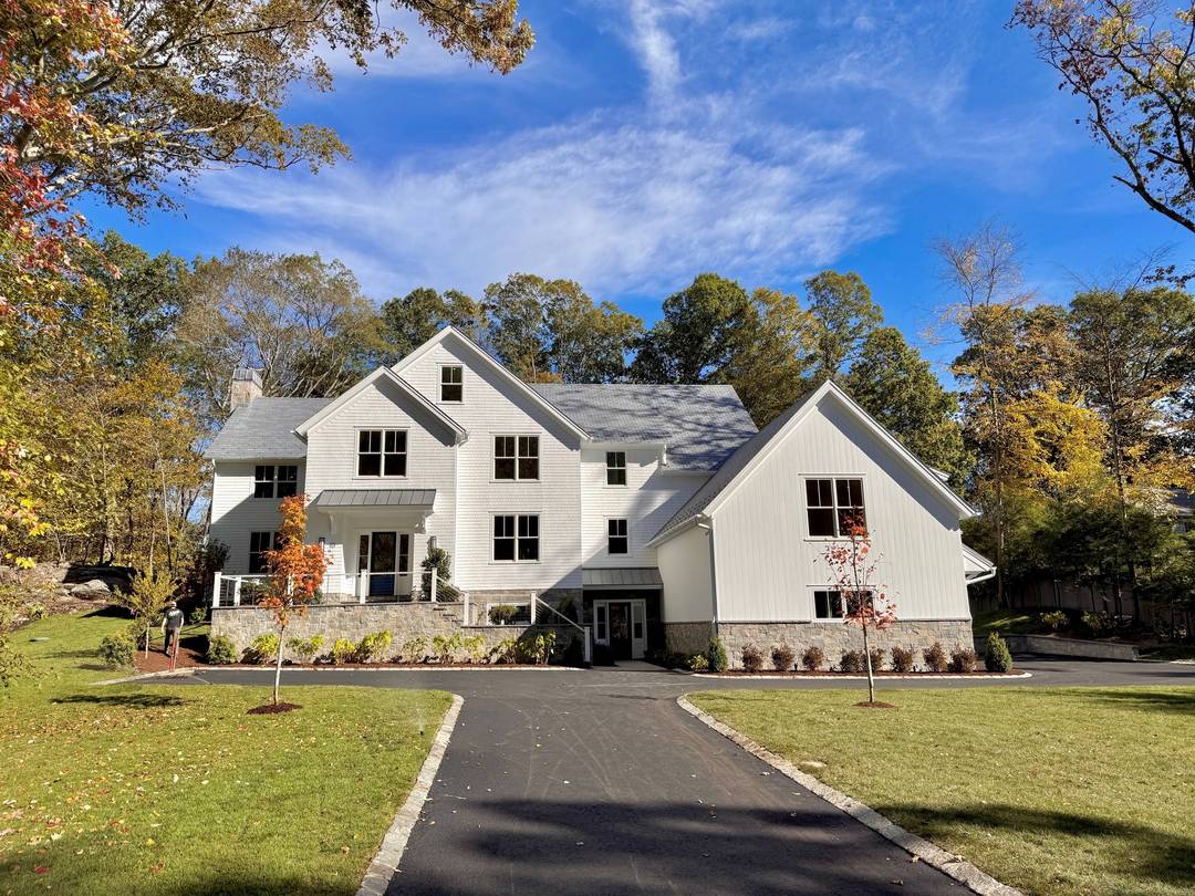 This exceptional Shingle Style Colonial blends form and function to inspire elegant everyday living.