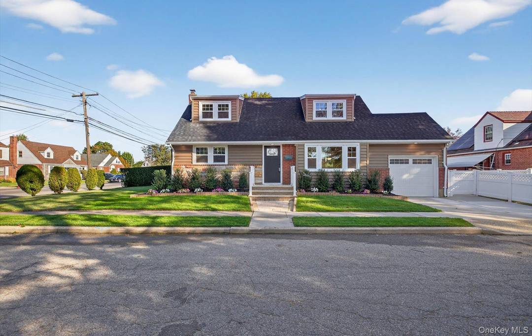 This special Cape Cod home sits proudly on a desirable corner property in the heart of Franklin Square.