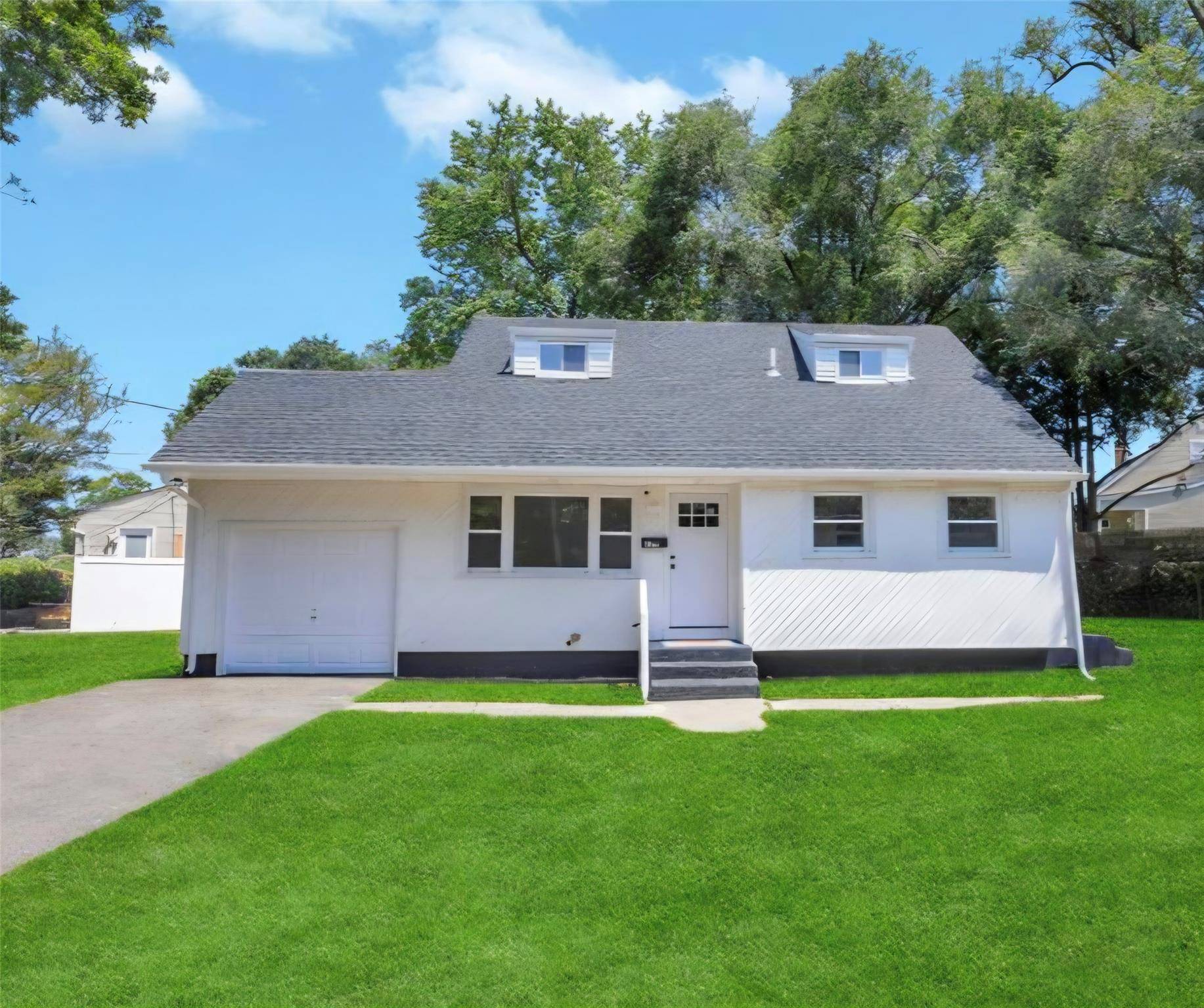 Charming Cape COD in Brentwood, Newly Renovated Cape that blends space, comfort, and practicality.