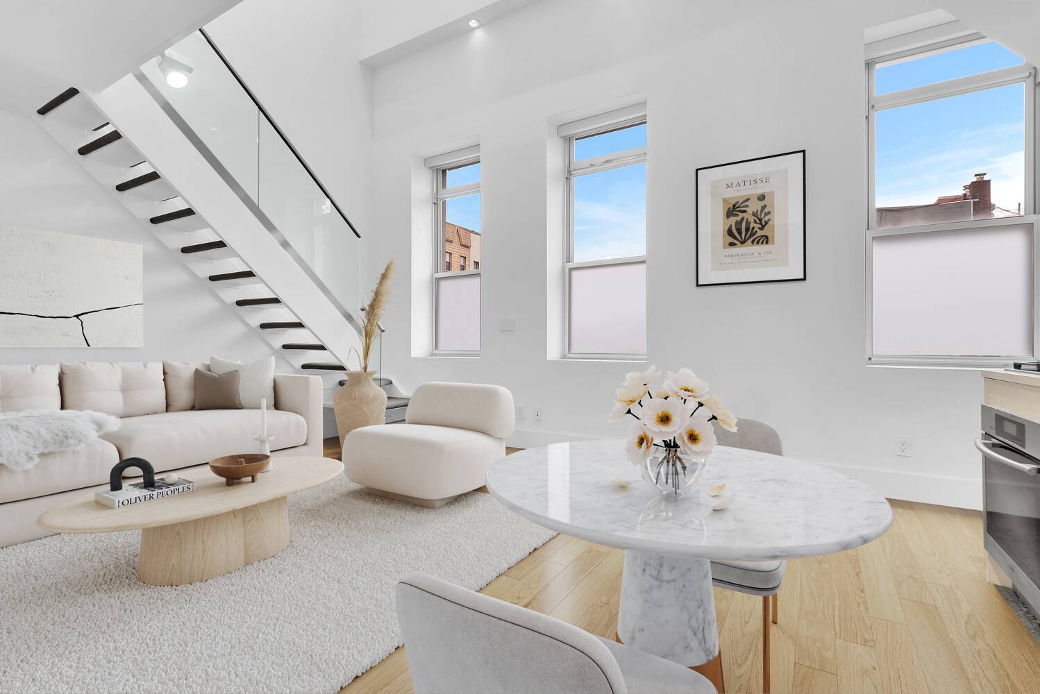 Major Price Reduction ! Sunlit and sophisticated, this striking triplex sits directly across from McCarren Park, offering the perfect blend of modern design and everyday comfort.