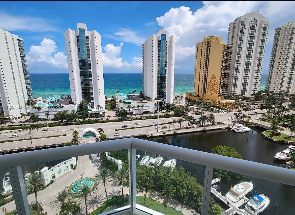 BEAUTIFUL AND LARGE APARTMENT IN THE EXCLUSIVE ISLAND IN THE HEART OF SUNNY ISLES WITH AND AMAZING OCEAN VIEW AND INTRACOASTAL FROM THE WRAP AROUND BALCONY FULLY FURNITURE, NEW APPLIANCES, ...