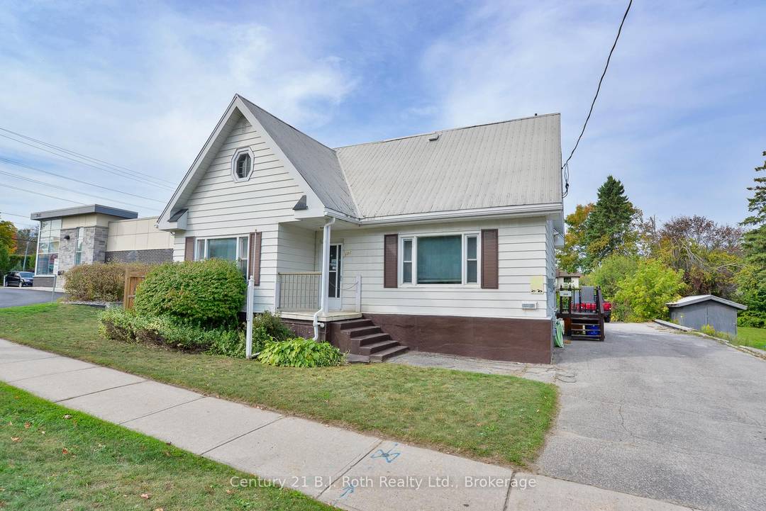 Conveniently located office space featuring three spacious offices, kitchenette, plenty of parking and storage space in the basement.