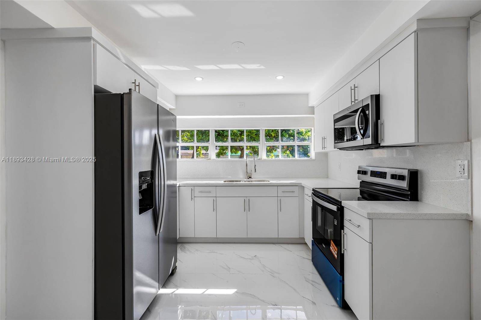 Meticulously remodeled 4 bedroom, 2 bath home near Hard Rock Stadium !