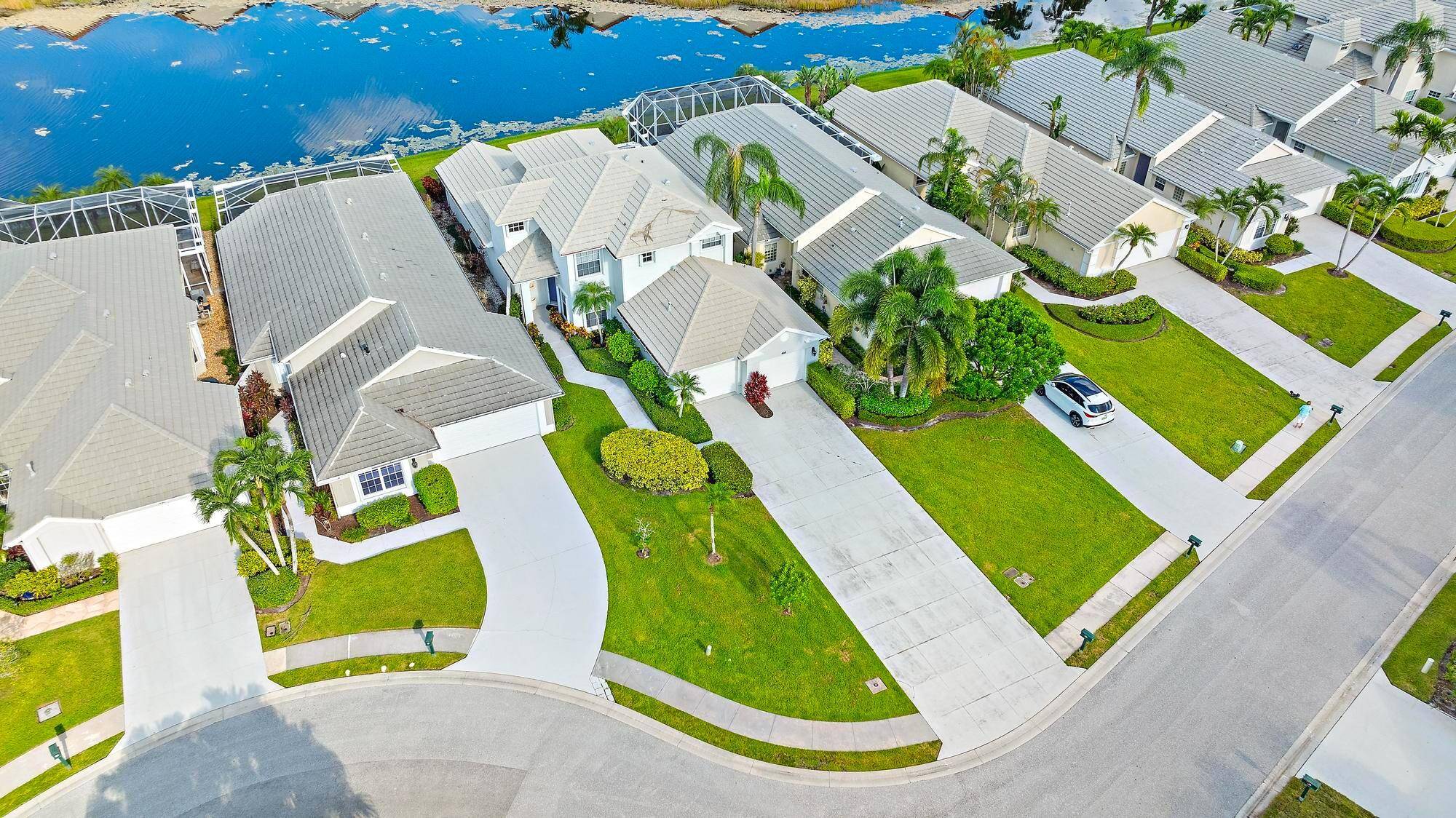 Fully furnished turnkey light filled lakefront home in desirable Masters community.