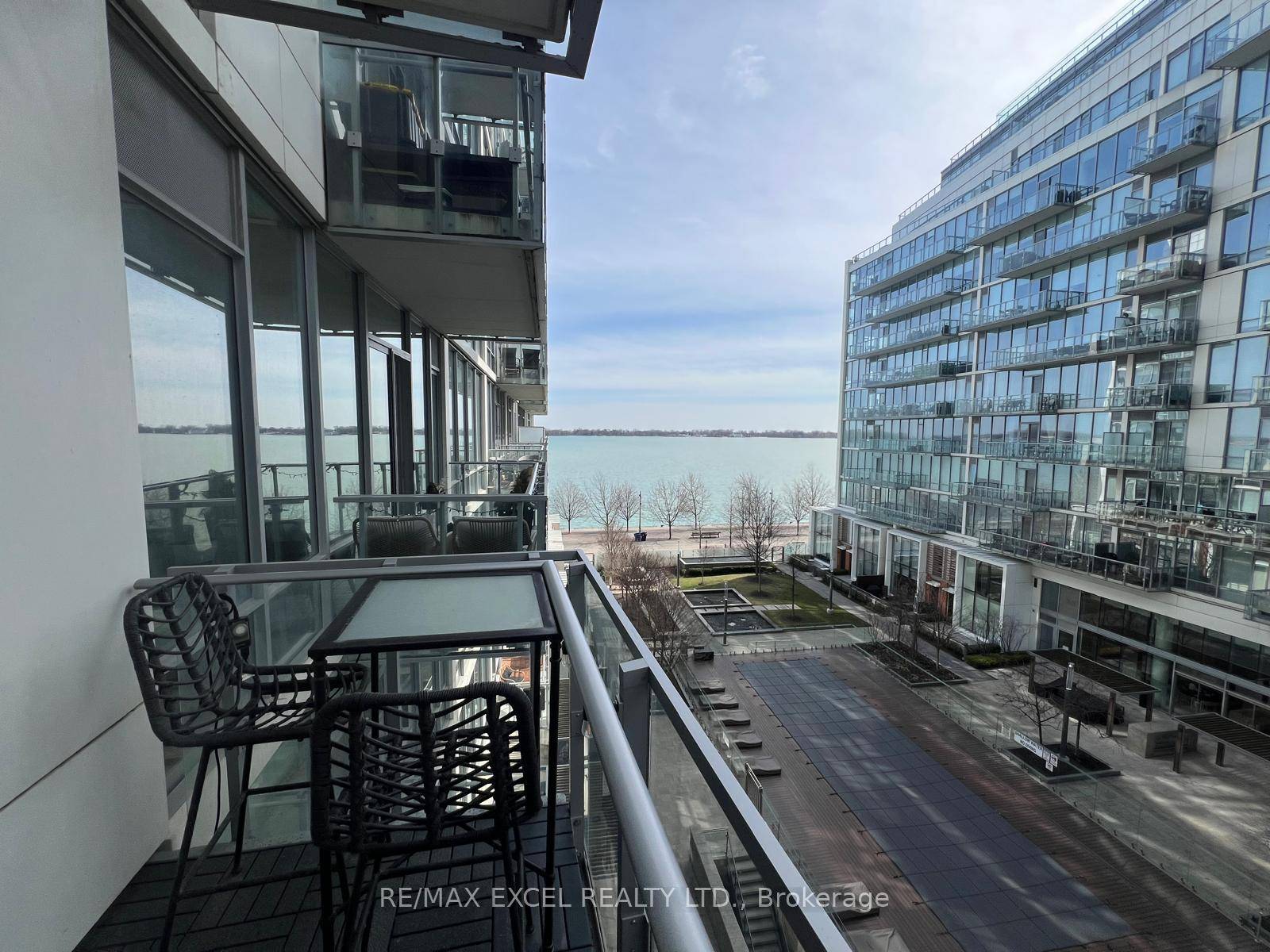Live at the Prestigious Pier 27, a World Class Waterfront Luxury Condo with View of Lake Ontario and pool from your spacious terrace like Private Balcony !